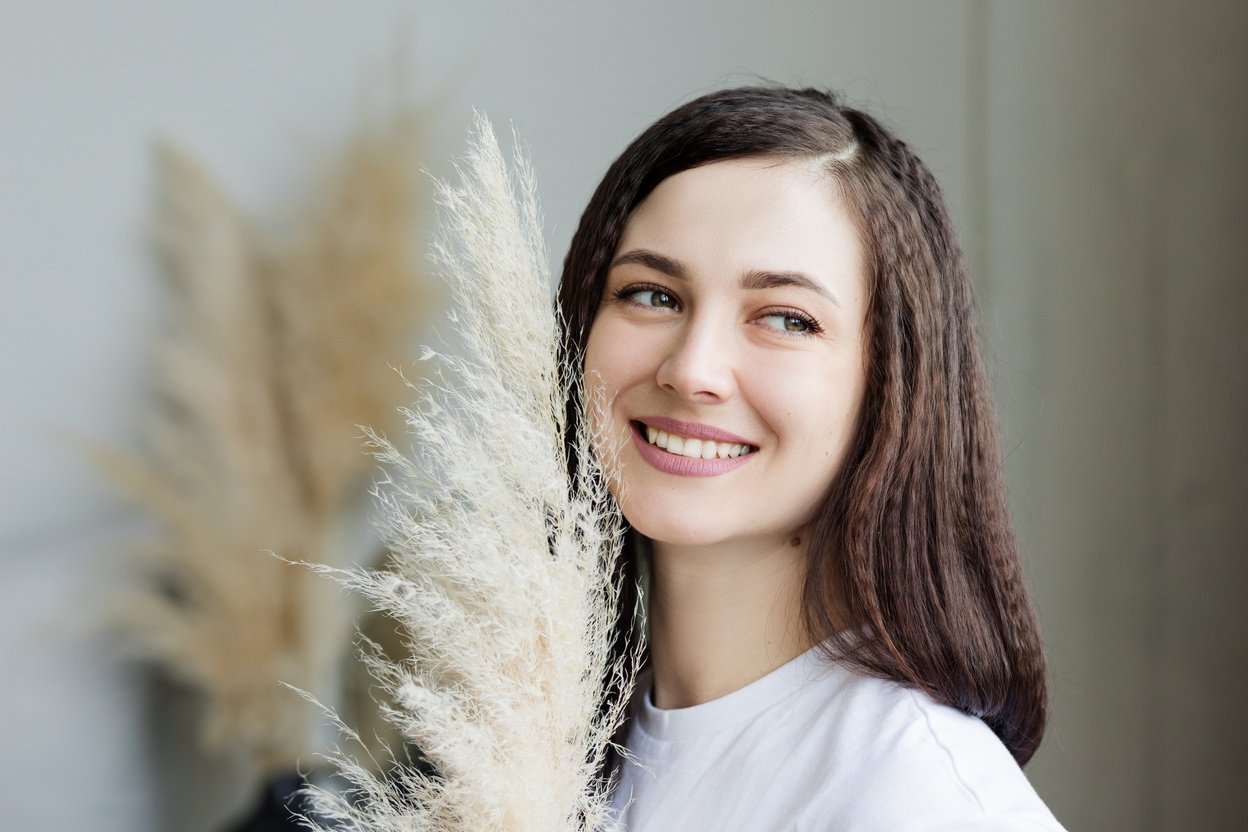 Woman in White Shirt Smiling